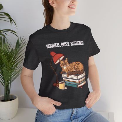 Booked. Busy. Bothered. cat t-shirt — close-up of print design