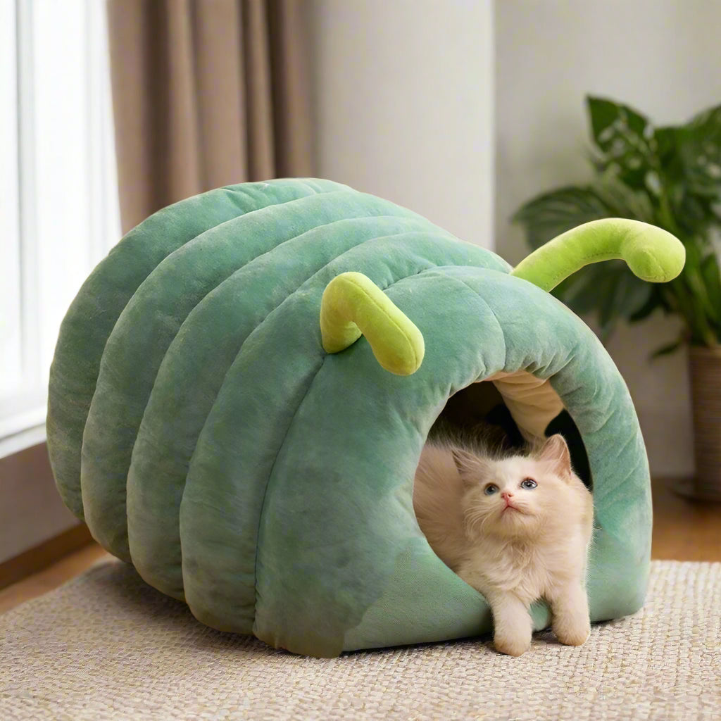 PawWorm caterpillar cave bed in green — front view showing round tunnel entrance and lime-green antennae