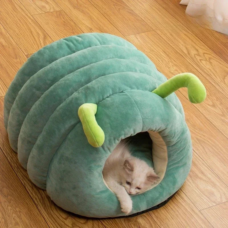 PawWorm green caterpillar bed with cat exiting — ribbed segmented body with curled tail detail