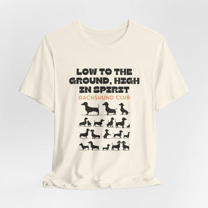 Natural Dachshund Club graphic tee laid flat showing Low to the Ground High in Spirit print