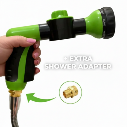 Green dog shower spray gun with built-in soap dispenser and brass adapter on a clean white background.