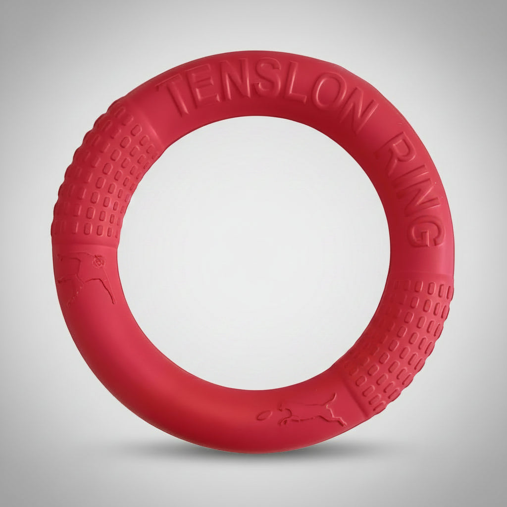 Red rubber ring dog toy being twisted to show durability and flexibility