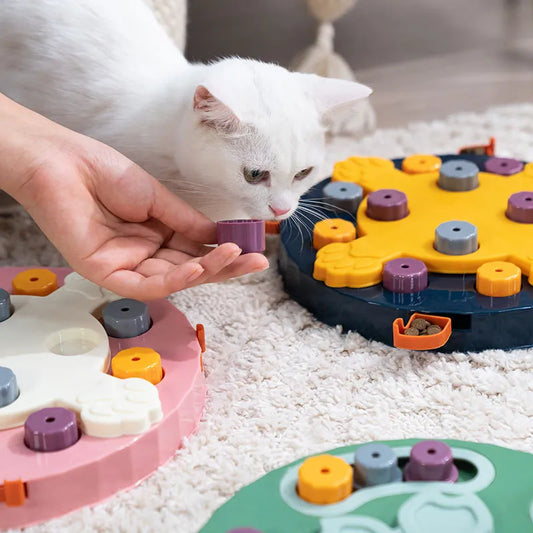 Close-up of green dog puzzle feeder showing flower-shaped centre and treat-hiding pegs