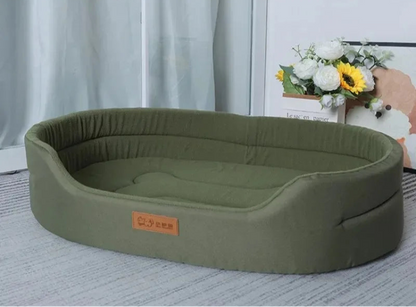 Green pet bed with a brand label on a light background