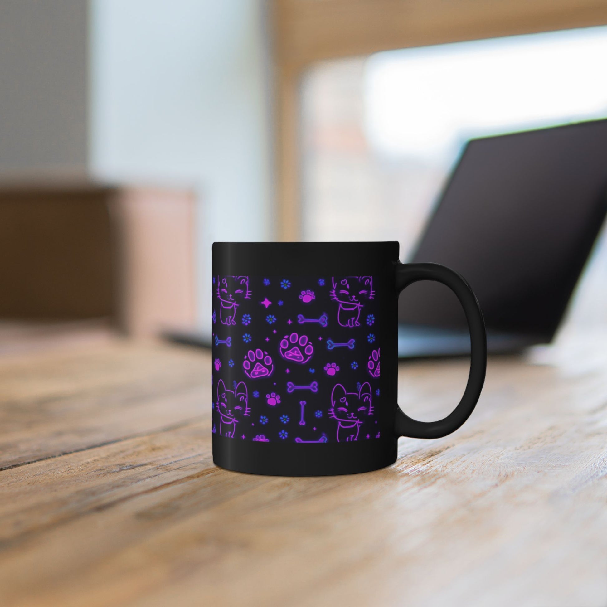 Neon cat pattern mug shown in hand