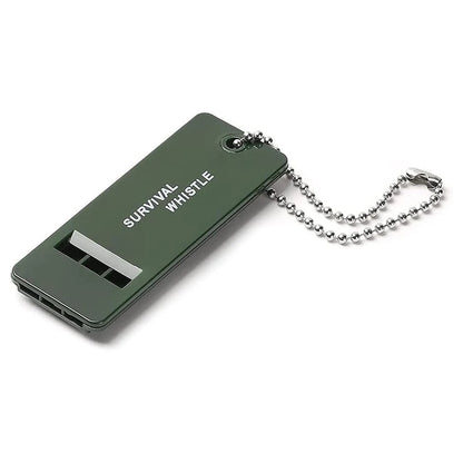 Olive green PawCall recall whistle with steel ball chain, embossed "Survival Whistle" text visible on the body
