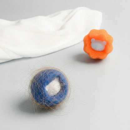 A blue PawCatch sponge ball after a wash, with collected pet hair caught in the sponge texture.