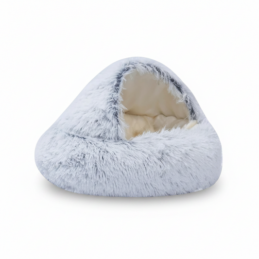 PawCave™ long-pile plush igloo cat cave bed in gray, showing curved front opening and shaggy exterior