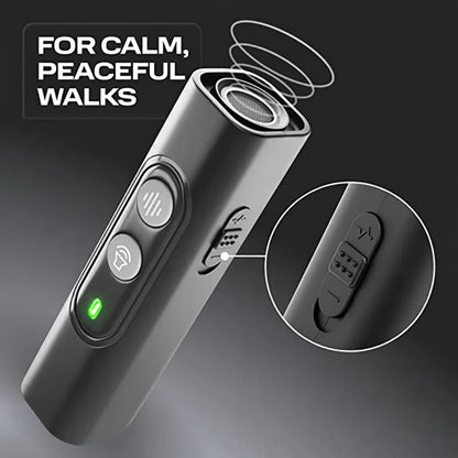  handheld ultrasonic dog bark training device with black lanyard and metal carabiner clip on neutral surface