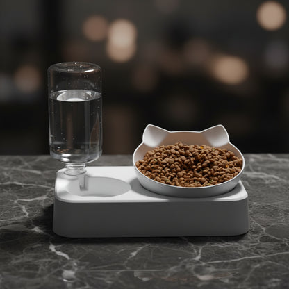 White PawNook cat feeding station with tilted cat-shaped bowl and clear gravity water bottle.