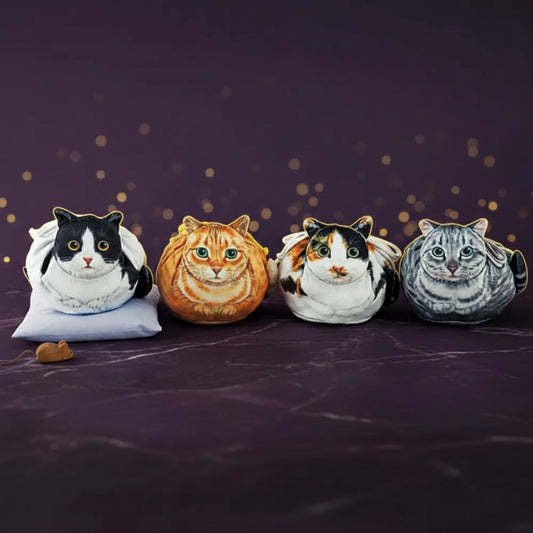 Four plush cat face drawstring pouches in a row — tuxedo, ginger tabby, calico and grey tabby designs