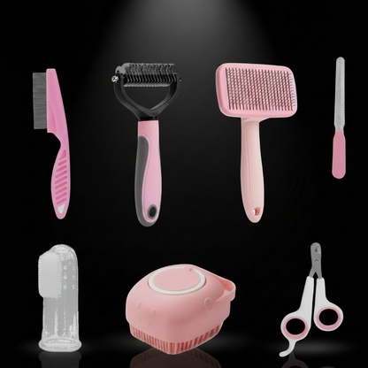 PawSpa pet grooming kit flat-lay — slicker brush, deshedding tool, comb, nail clippers, file, silicone shampoo brush, finger toothbrush, storage pouch.
