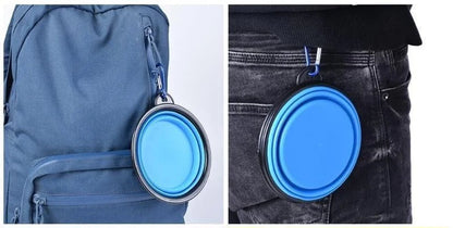 Blue PawTrek silicone travel bowl with hard rim and carabiner, expanded for use.