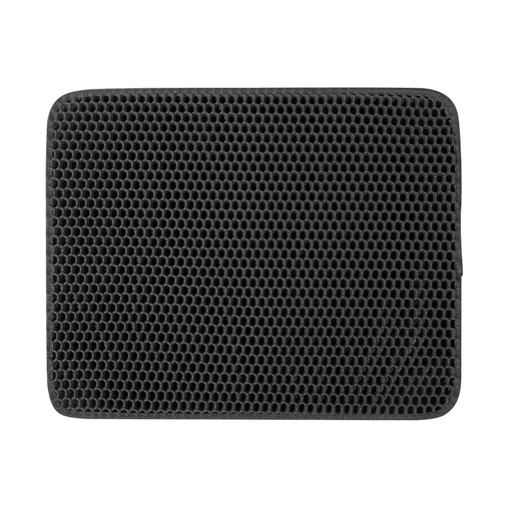 Black honeycomb patterned cat litter mat on a white background