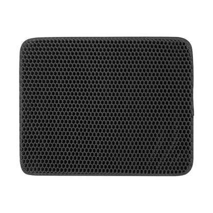 Black honeycomb patterned cat litter mat on a white background