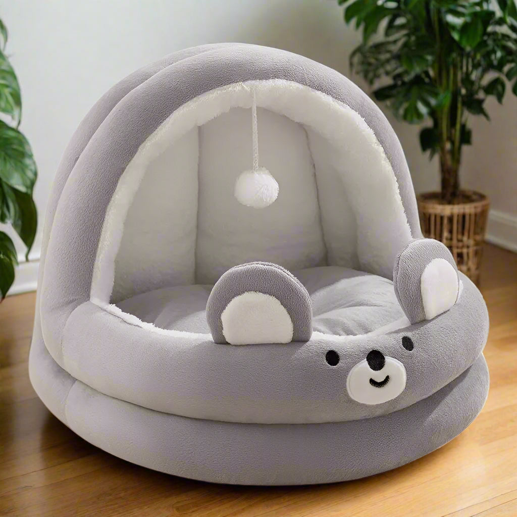 PawCave cat cave bed grey — cat sleeping inside with removable cushion base visible