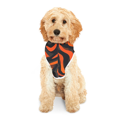 Dog wearing a black and orange bandana on a white background