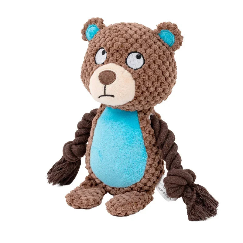 Brown teddy bear plush dog toy with a blue belly and rope, on a white background