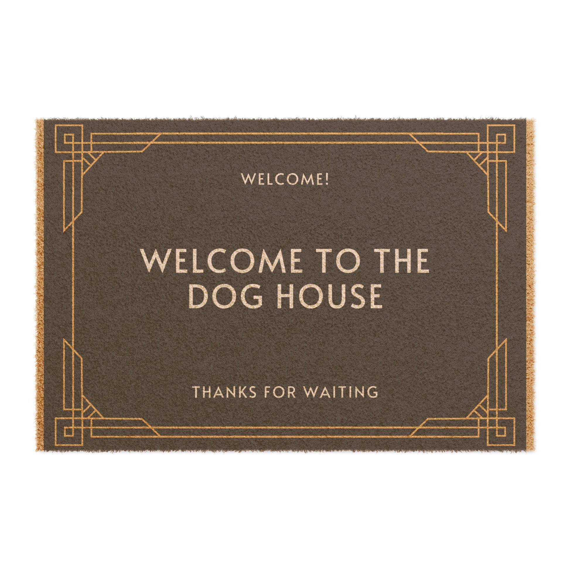 A brown coir doormat with a black vinyl backing, featuring the text 'WELCOME TO THE DOG HOUSE' in capital letters on a plain background.