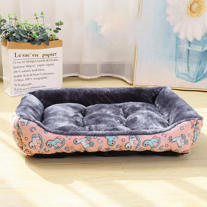 Dog bed with pink and blue pattern on a wooden floor